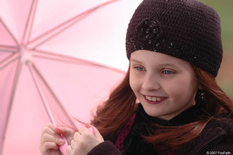 Despite the rain, Emily (Abigail Breslin) finds a reason to smile in "The Ultimate Gift." 