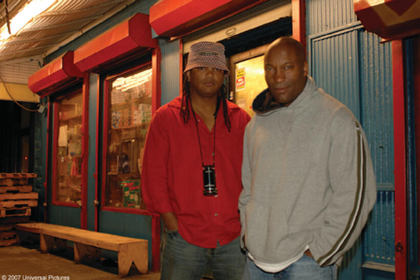 Director Franc Reyes and producer John Singleton on the set of "Illegal Tender."
