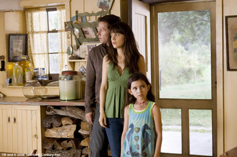 On the run from a widening crisis, Elliot (Mark Wahlberg), Alma (Zooey Deschanel) and Jess (Ashlyn Sanchez) check out an abandoned home in "The Happening."