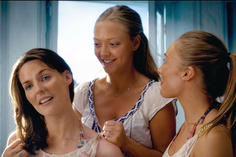 Best friends Ali (ASHLEY LILLEY), Sophie (AMANDA SEYFRIED) and Lisa (RACHEL MCDOWALL) discuss Sophie's upcoming wedding in  "Mamma Mia!"