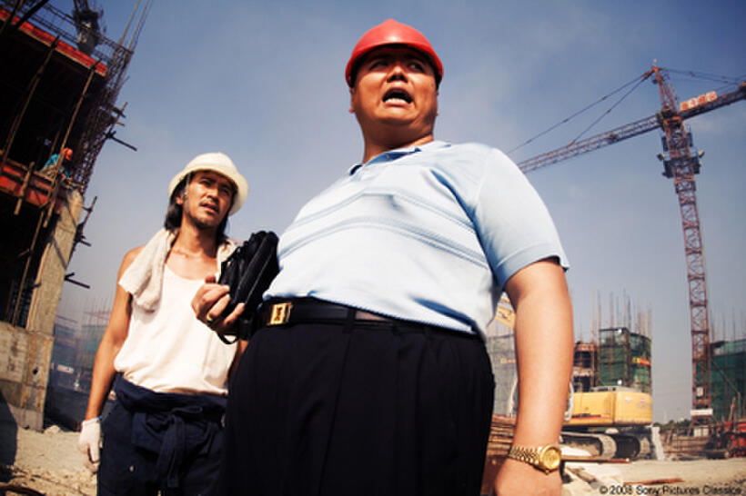 Stephen Chow as Ti and Lam Tze Chung as Boss in "CJ7."