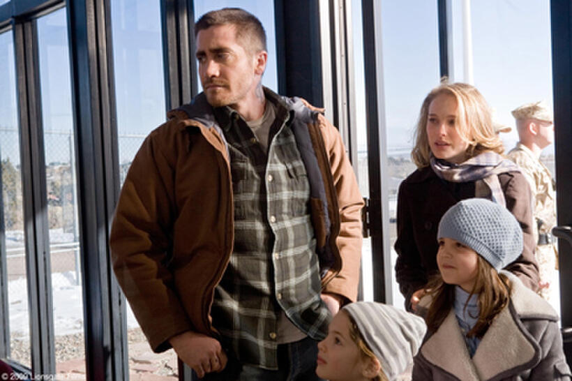 Jake Gyllenhaal as Tommy, Natalie Portman as Grace, Taylor Geare as Maggie (bottom left) and Bailee Madison as Isabelle (bottom right) in "Brothers."