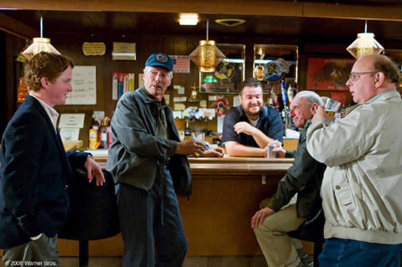 Christopher Carley as Father Janovich, Clint Eastwood as Walt Kowalski, Greg Trzaskoma as the bartender, Tom Majard as Mel and Davis Gloff as Darrell in "Gran Torino."
