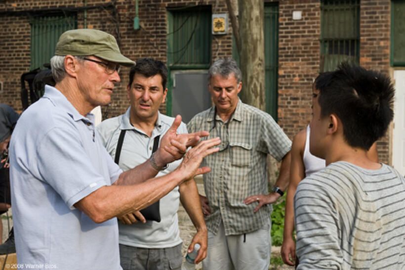 Director Clint Eastwood, camera operator Steve Campanelli, 1st assistant camera Bill Coe and actor Bee Vang on the set of "Gran Torino."