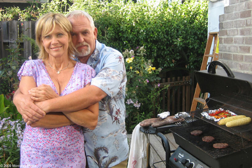 Cindy Pickett as Josie and John Ratzenberger as Art in "The Village Barbershop."