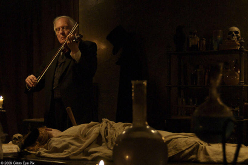 Angus Scrimm as Dr. Vernon Quint in "I Sell the Dead."