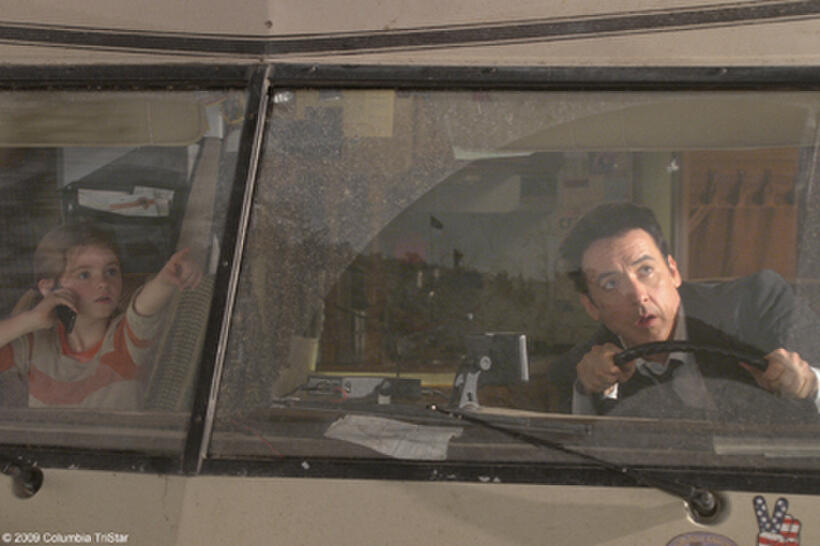 Morgan Lily as Lilly Curtis and John Cusack as Jackson Curtis in "2012."
