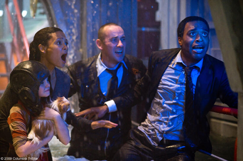 Morgan Lily as Lilly Curtis,  Thandie Newton as Laura Wilson, unknown actor, and Chiwetel Ejiofor as Adrian Helmsley in "2012."