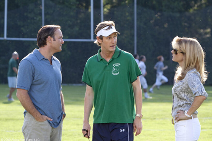 Tim McGraw as Sean Tuohy, Ray McKinnon as Coach Cotton and Sandra Bullock as Leigh Anne Tuohy in "The Blind Side."