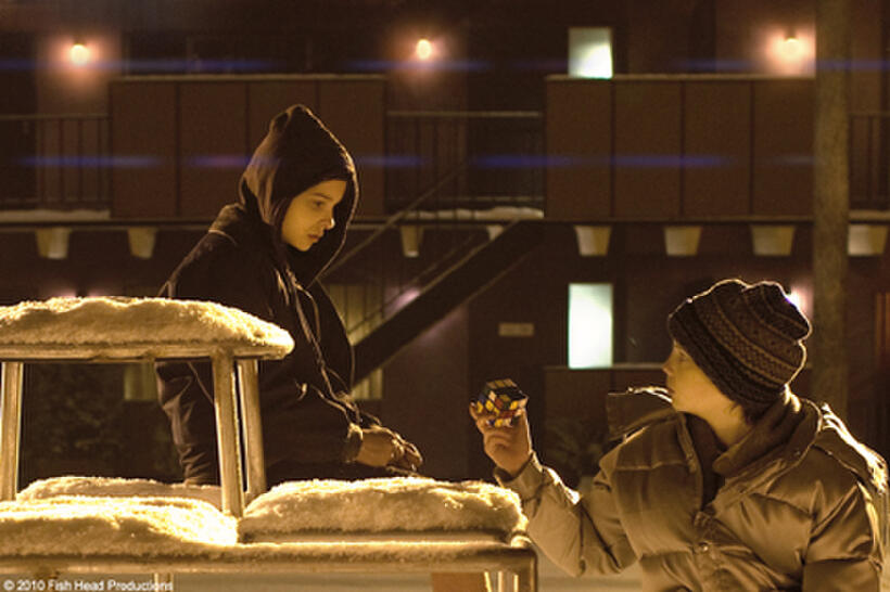 Chloe Moretz as Abby and Kodi Smit-McPhee as Owen in "Let Me In."