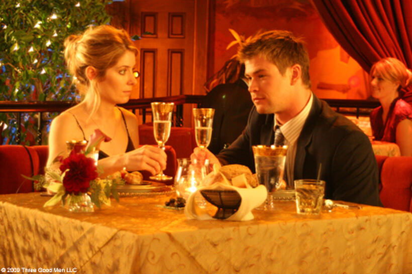 Victoria Profeta as Leslie and Chris Hemsworth as Sam in "Ca$h."