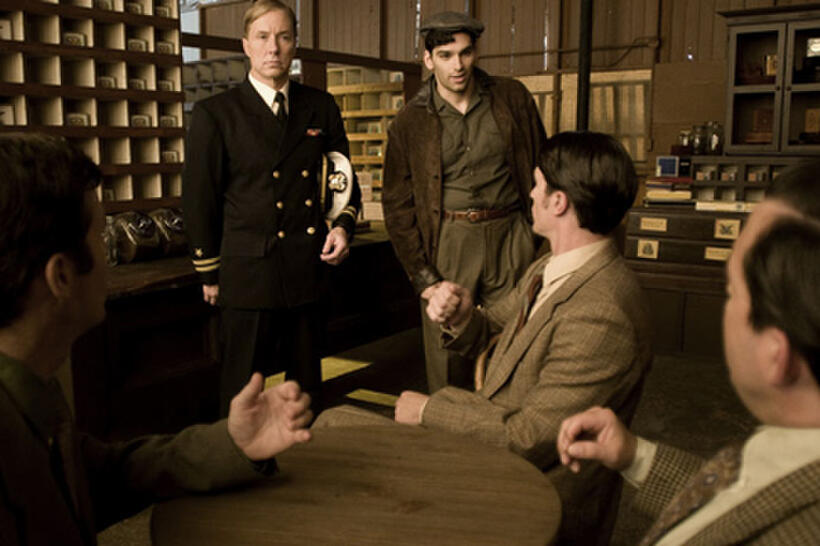 Lee Perkins as F. Ellis Coburn and Donal Thoms-Cappello as Eddie Doyle in ``The Red Machine.''